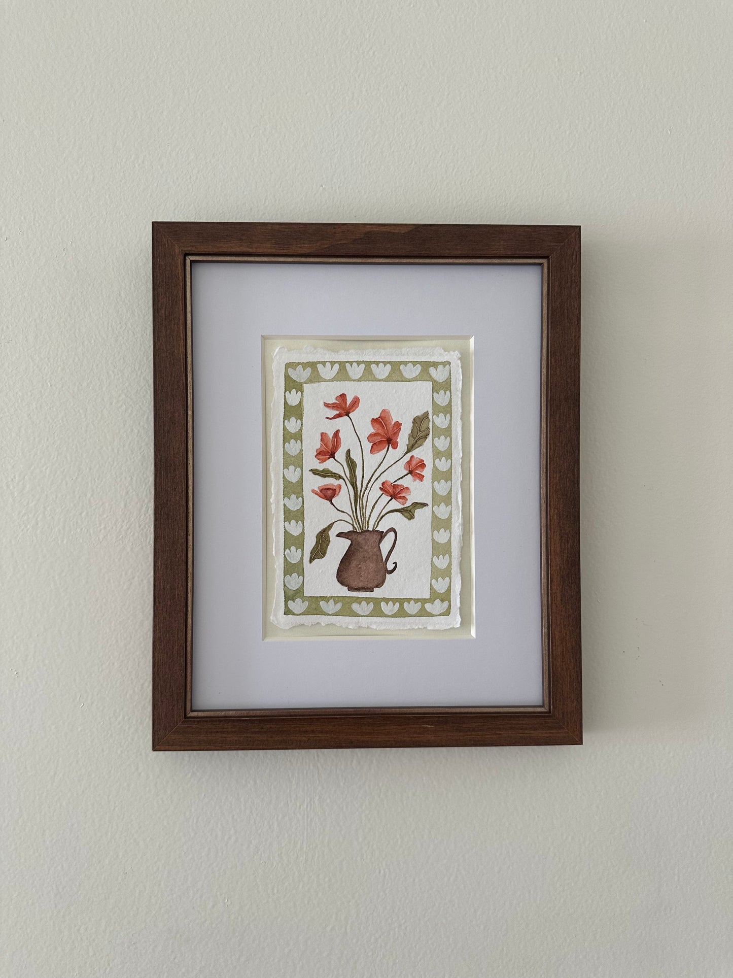 Red flowers in brown vase, framed