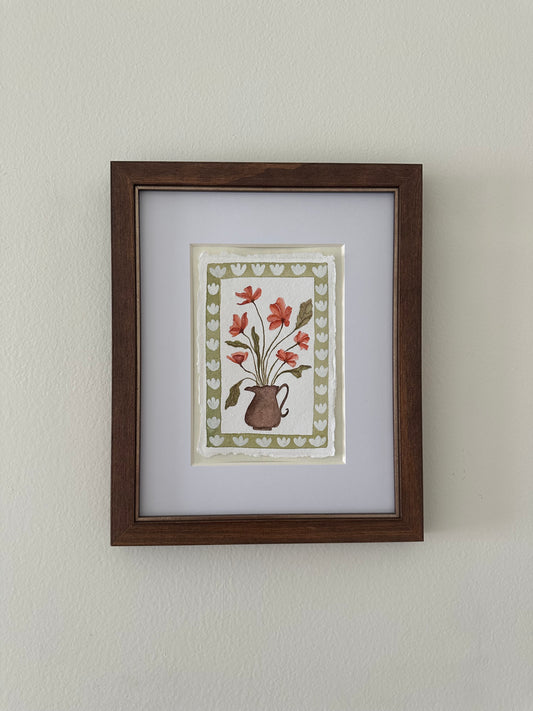 Red flowers in brown vase, framed