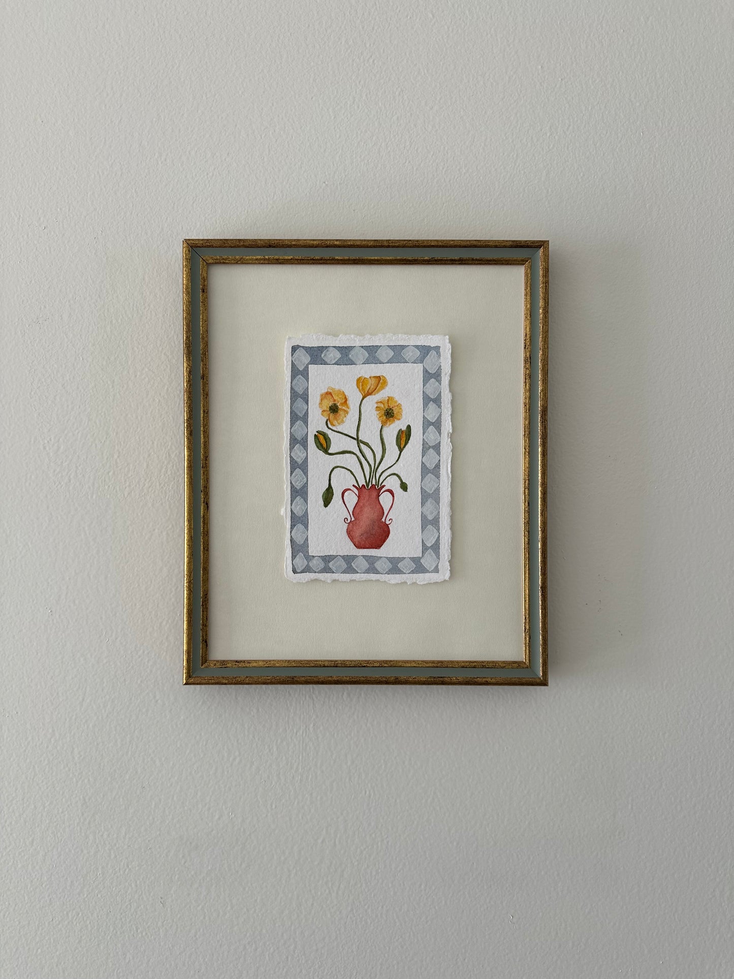 Yellow flowers in red vase, framed