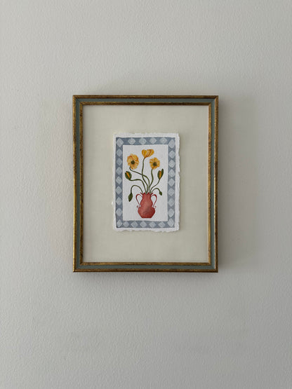 Yellow flowers in red vase, framed