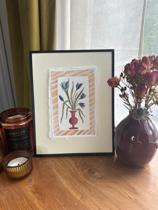 Blue flowers in red vase, framed