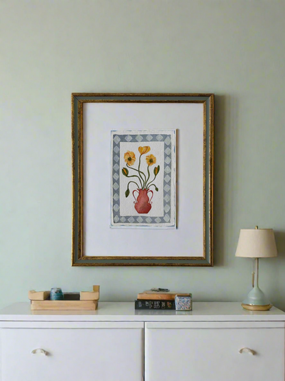 Yellow flowers in red vase, framed