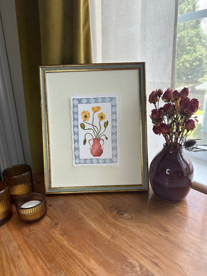 Yellow flowers in red vase, framed