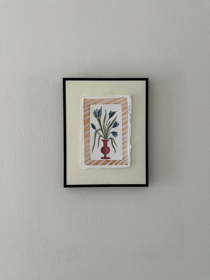 Blue flowers in red vase, framed